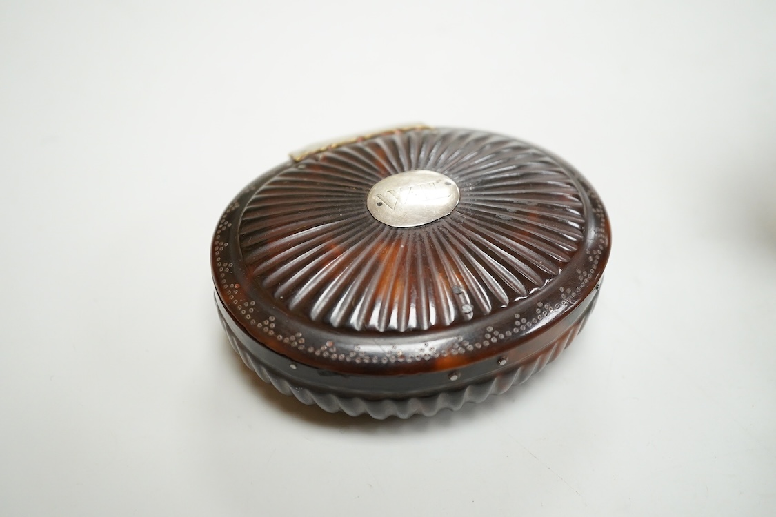 An 18th century tortoiseshell oval fluted snuff box, 89mm and a George V silver and tortoiseshell mounted trinket box, London, 1916.